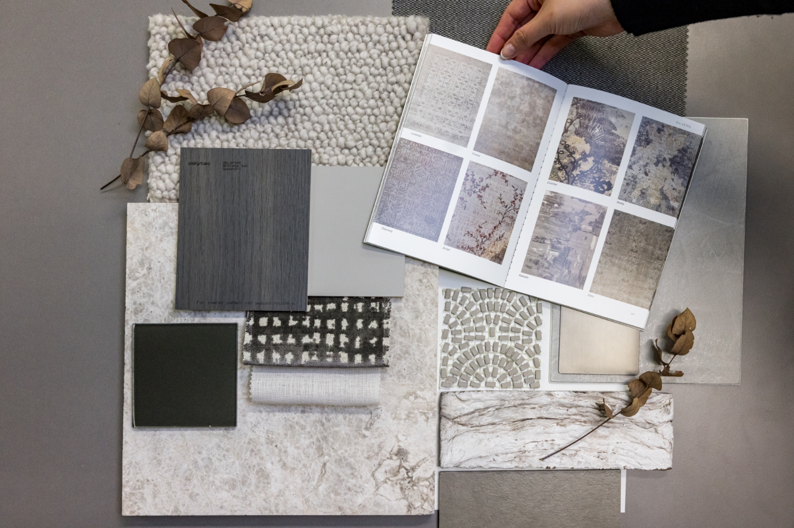 Interior design materials palette with fabric, tiles, and samples.